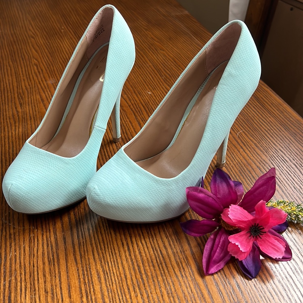 Light teal platforms. Womens US 7. Gently used.